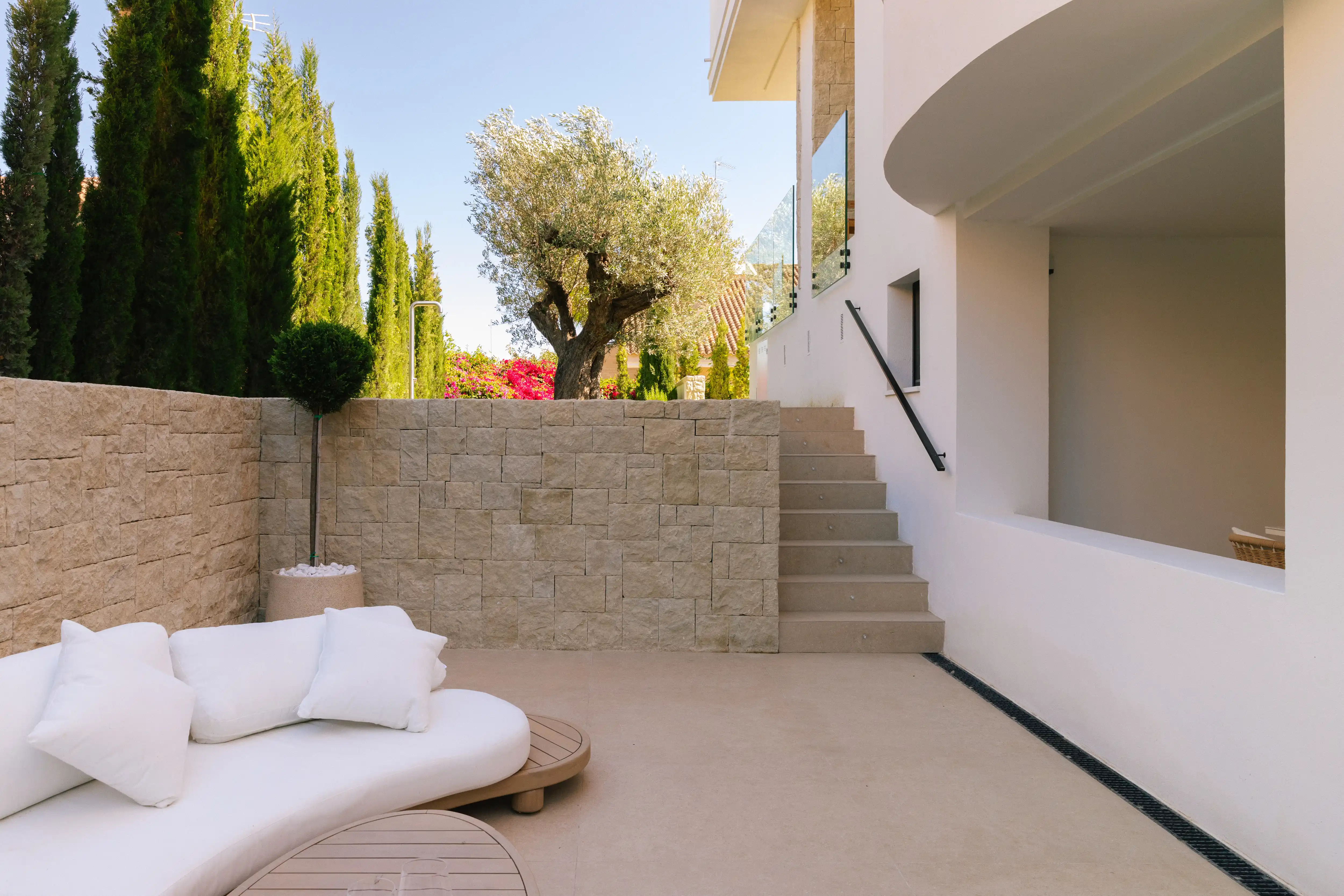 Outdoor terrace and pool area after villa renovation in Campolivar Valencia image 75