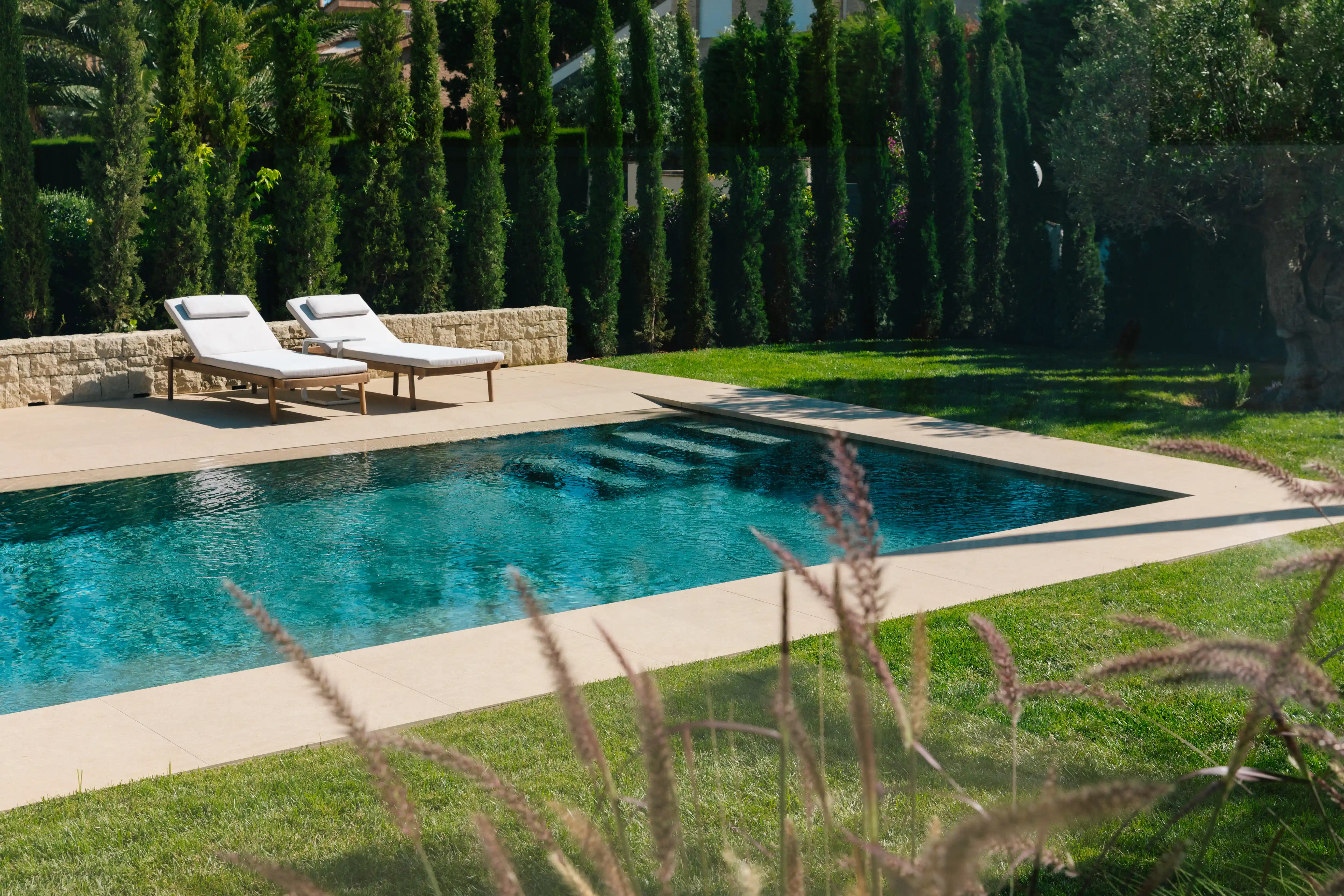 Outdoor terrace and pool area after villa renovation in Campolivar Valencia image 76