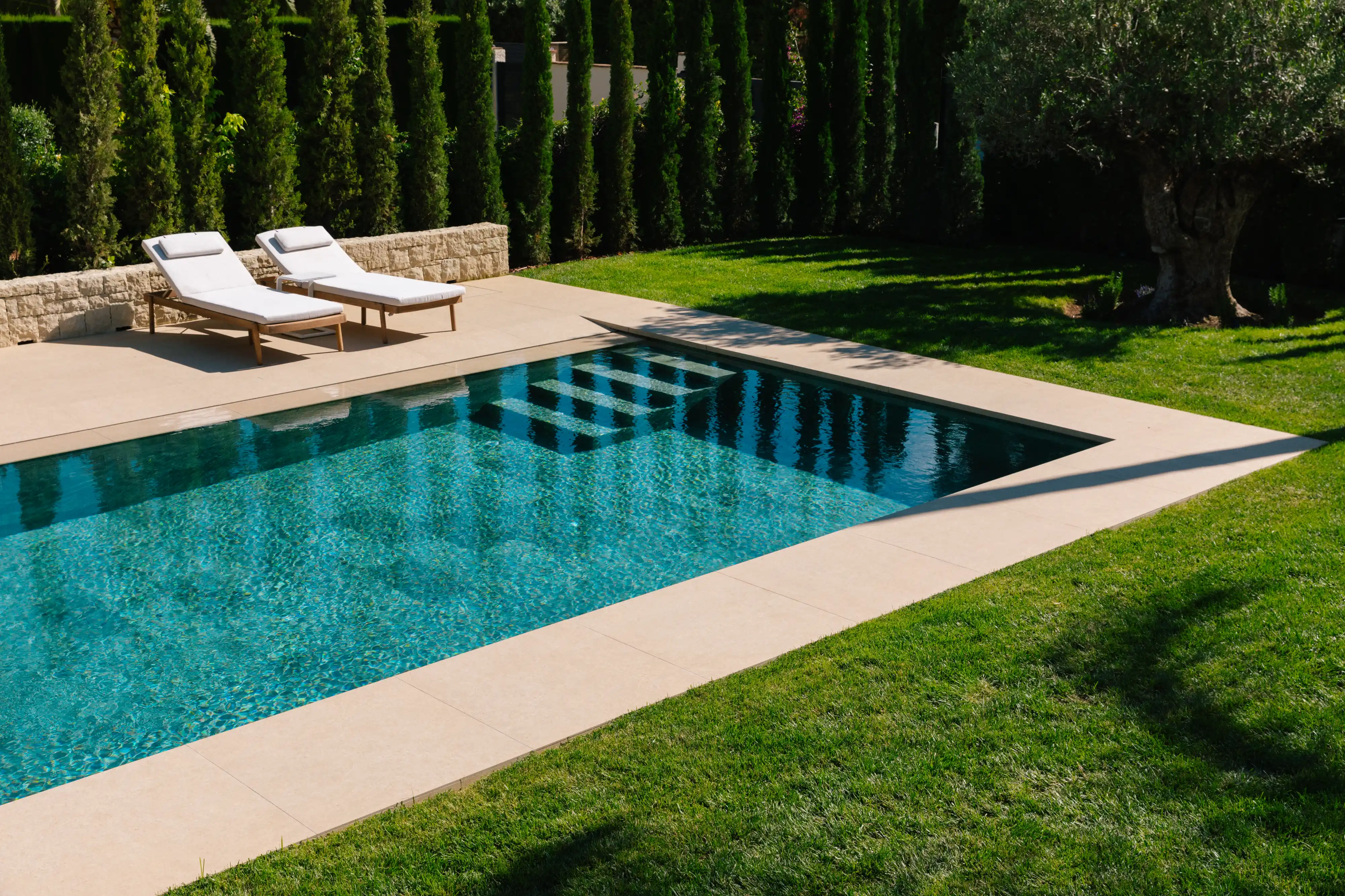 Outdoor terrace and pool area after villa renovation in Campolivar Valencia image 77