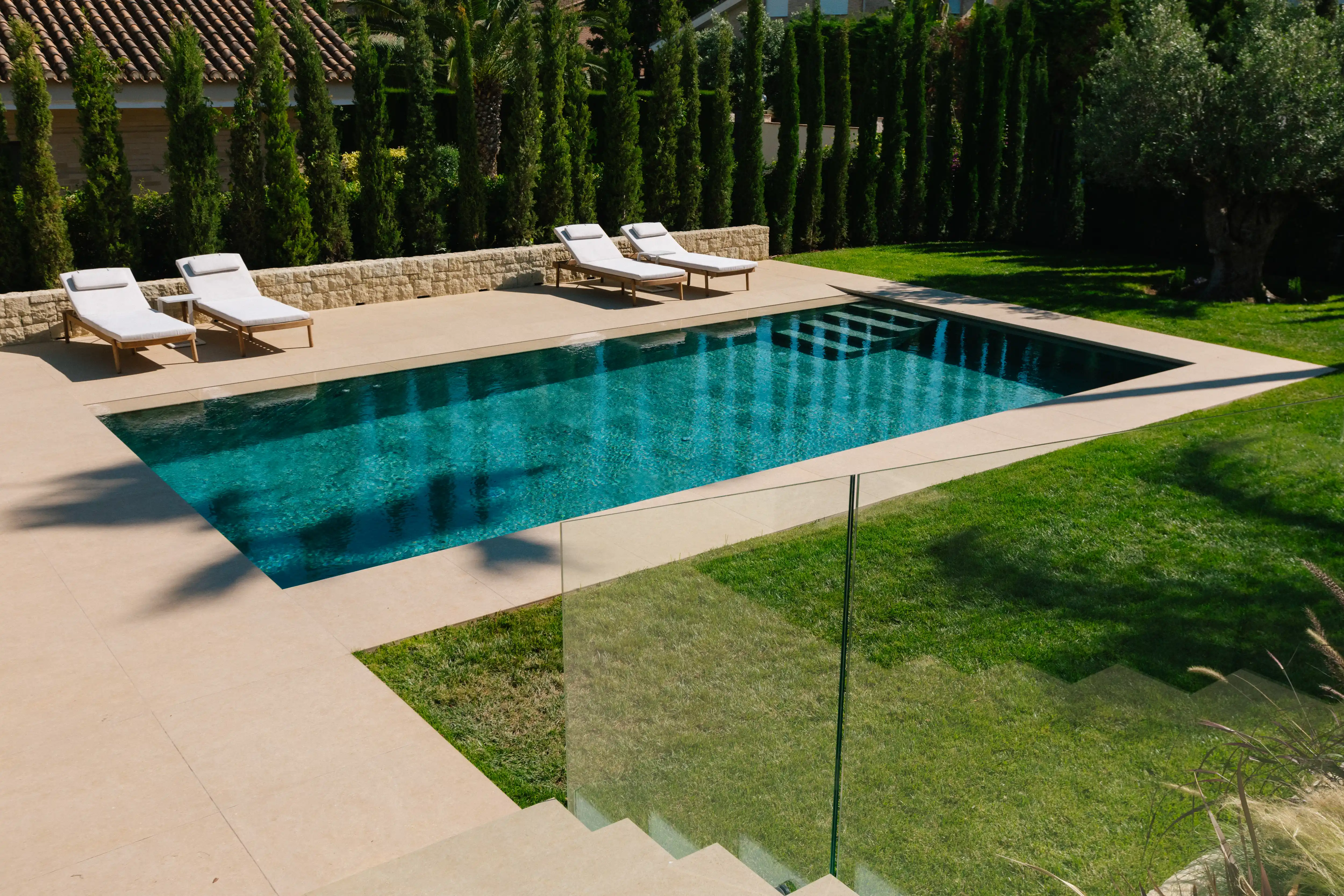 Outdoor terrace and pool area after villa renovation in Campolivar Valencia image 78