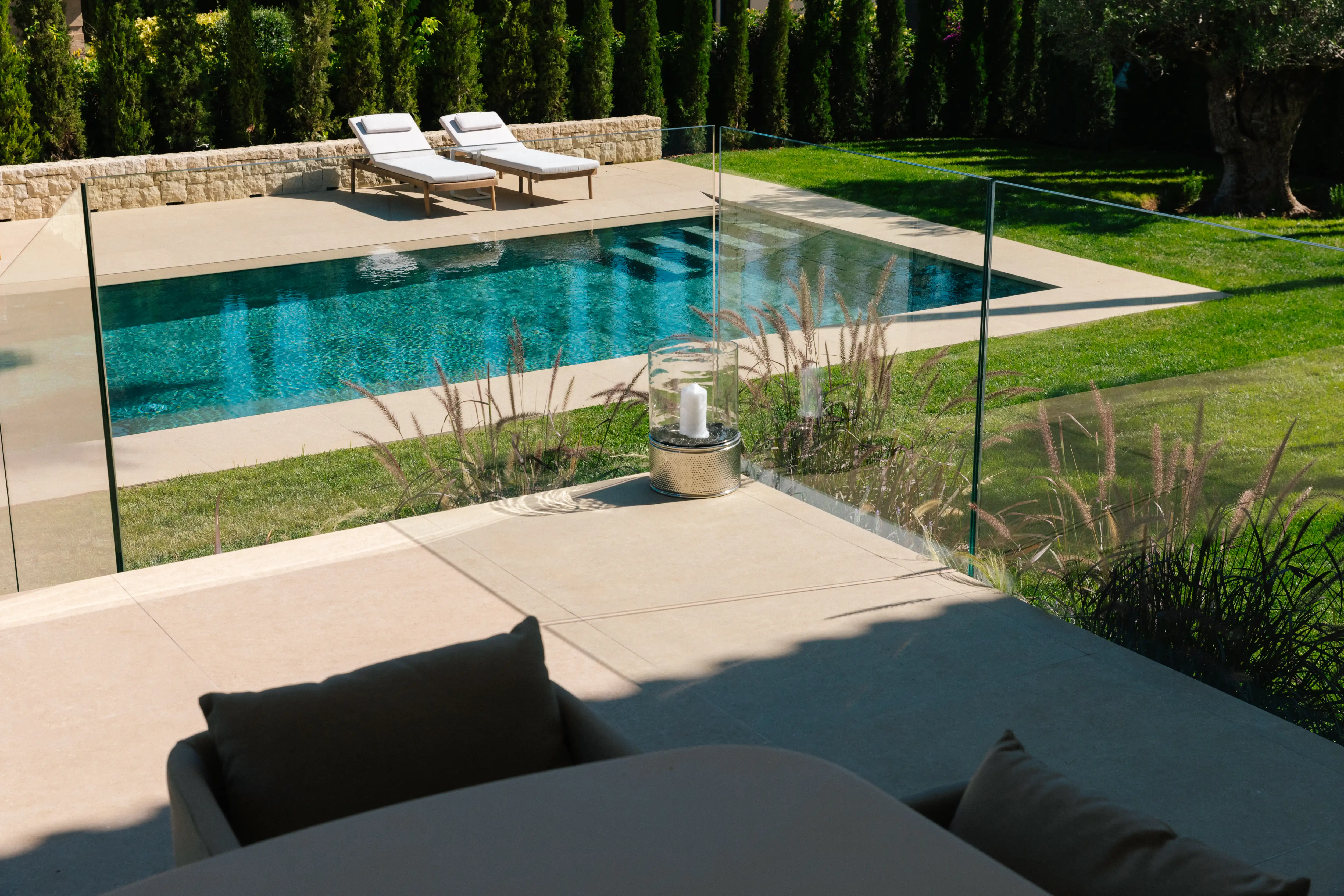 Outdoor terrace and pool area after villa renovation in Campolivar Valencia image 81
